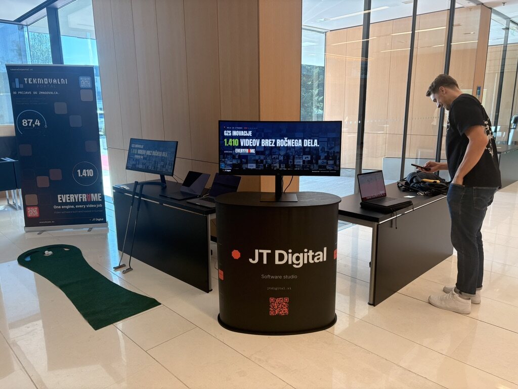 Our stand at Dan inovativnosti: the JT Digital counter, our film on the wide screen and laptops for the Competify demo.