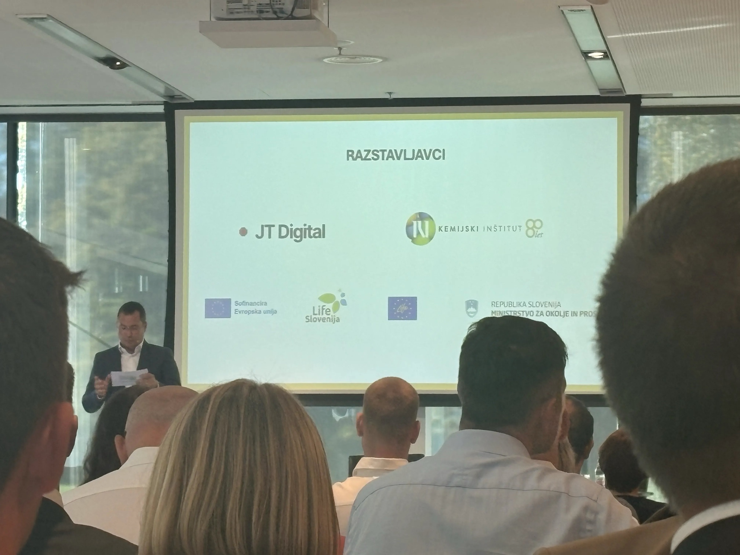 JT Digital on the exhibitors slide during a talk at Dan inovativnosti 2026, seen from the audience